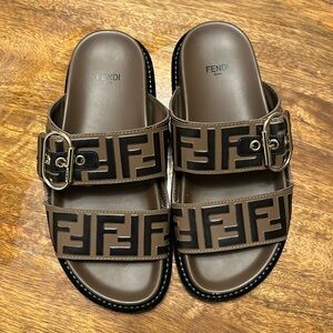 Leather Fendi clogs/slides with gold buckle
